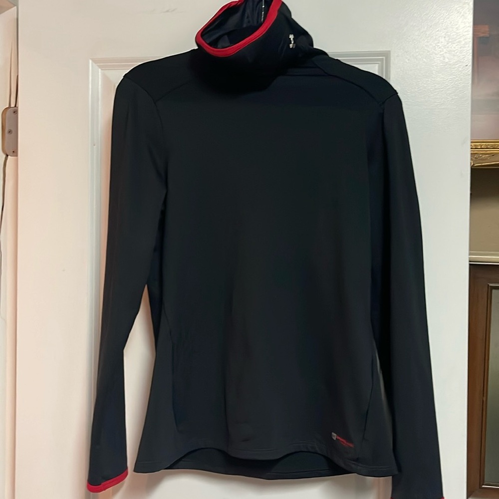 This is a black under armour jacket with a built-in mask